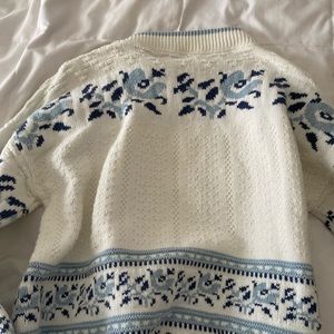 white and blue sweater